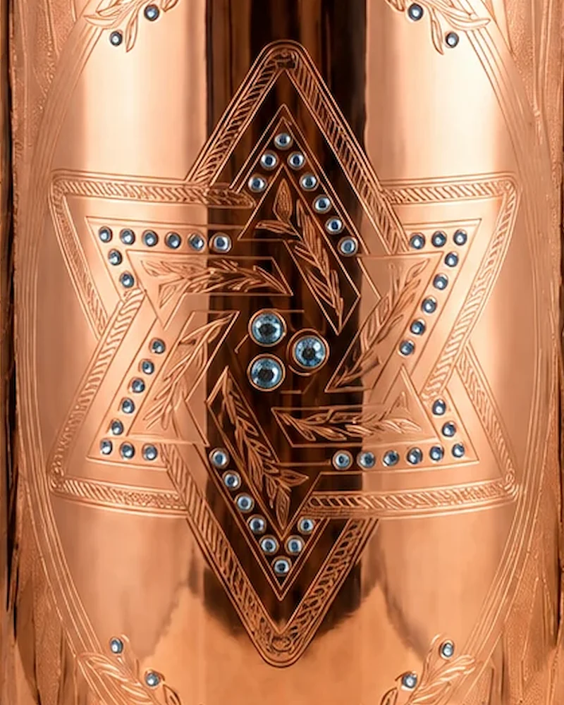 Close-up of the engraved Magen David set with sky-blue stones