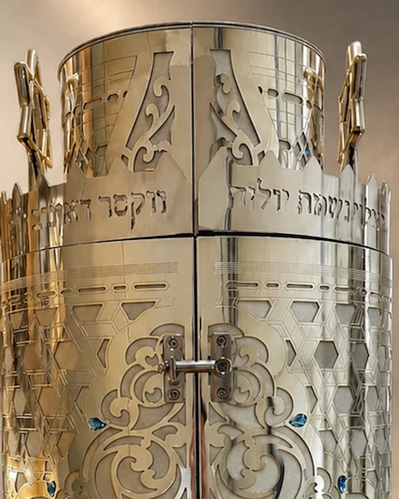 Close-up of the crown with its two Magen David finials and engraved band