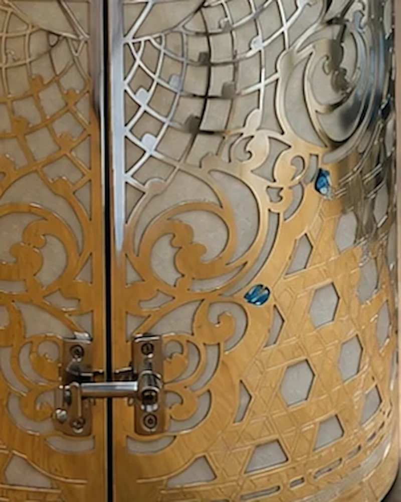 Close-up of the lace scrollwork set with blue stones