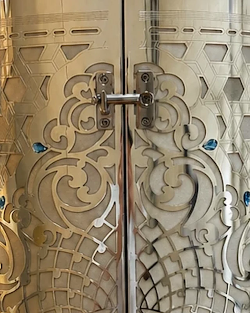 Close-up of the upper latch among the openwork scrolls